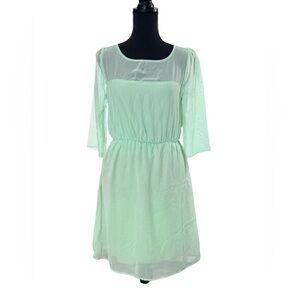 Mint green dress ideal for summer with transparent neckline and sleeves